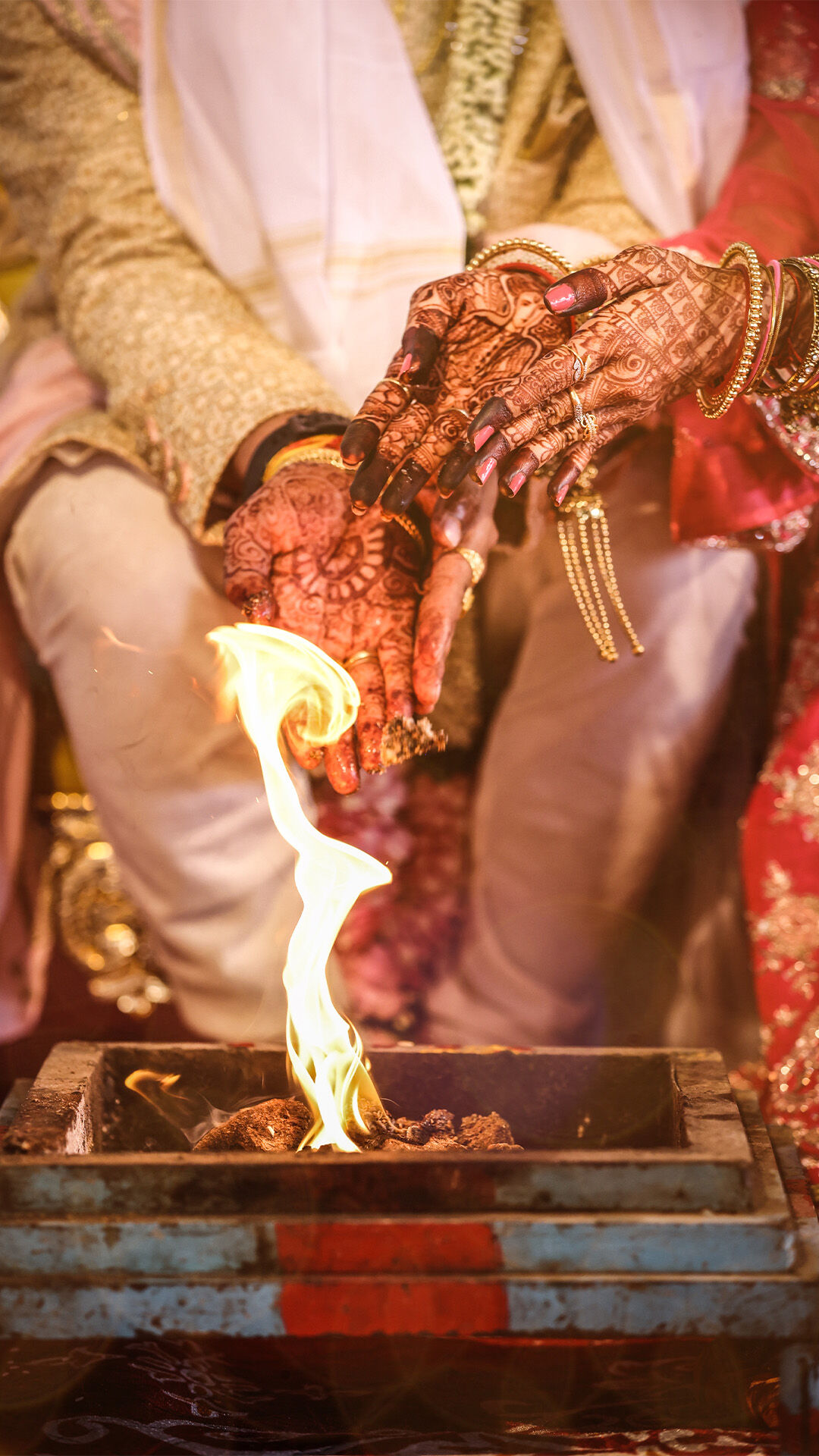 Bride and groom performing traditional Indian wedding rituals together